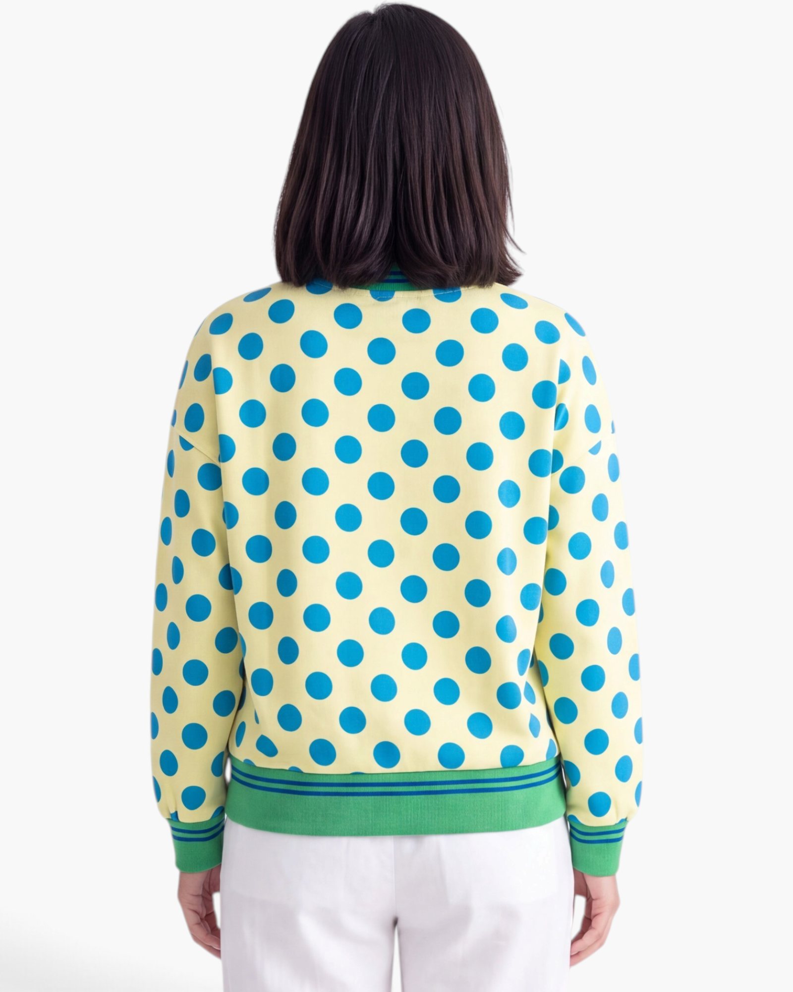 Beach Rose Co. yellow sweatshirt with blue polka dots and green striped hem, back view.
