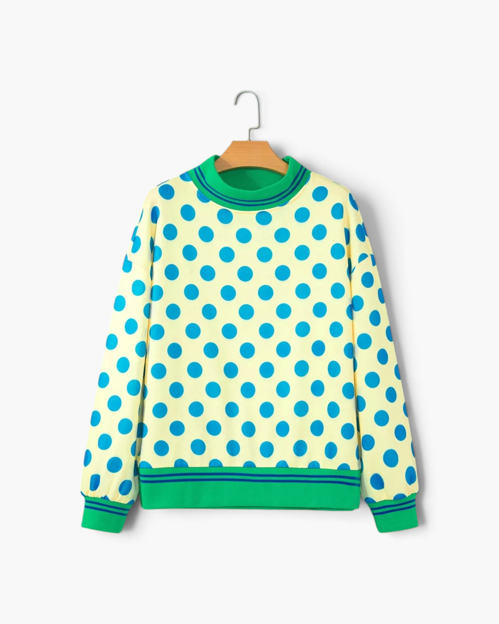 Beach Rose Co. yellow polyester sweatshirt with blue polka dots and green striped trim on a hanger.