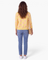 Beach Rose Co. yellow knit cardigan with pink polka dots, long sleeves, and ribbed hem, worn with jeans from behind.