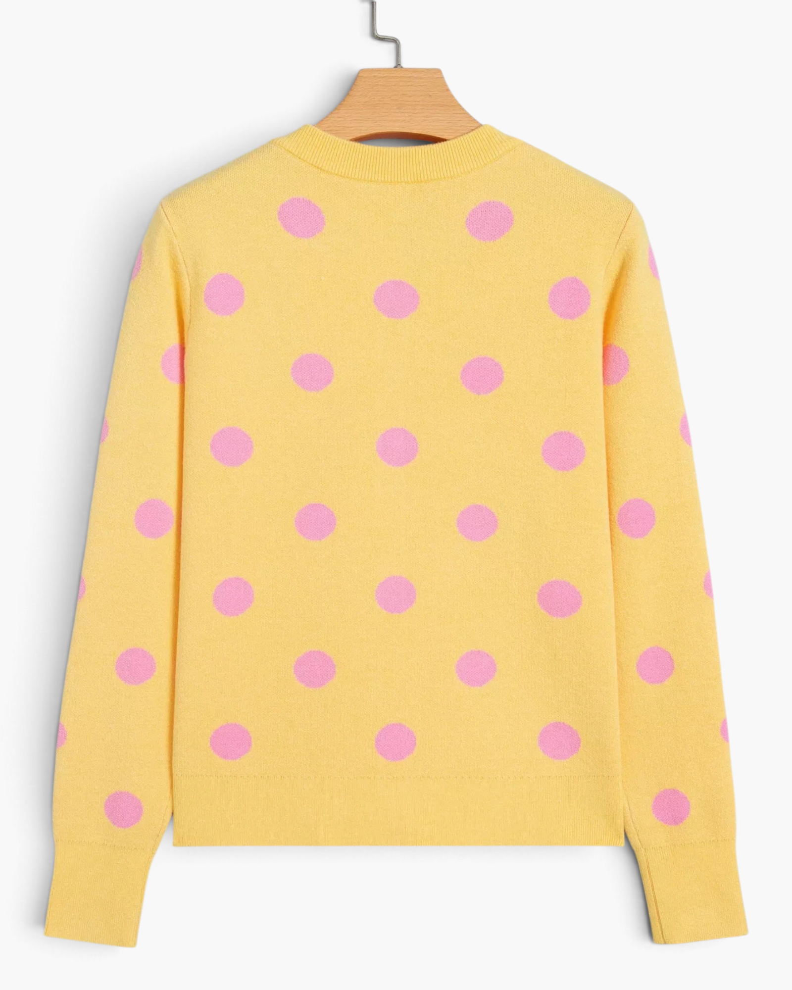 Beach Rose Co. yellow knit cardigan with pink polka dots, long sleeves, and ribbed hem, back view.