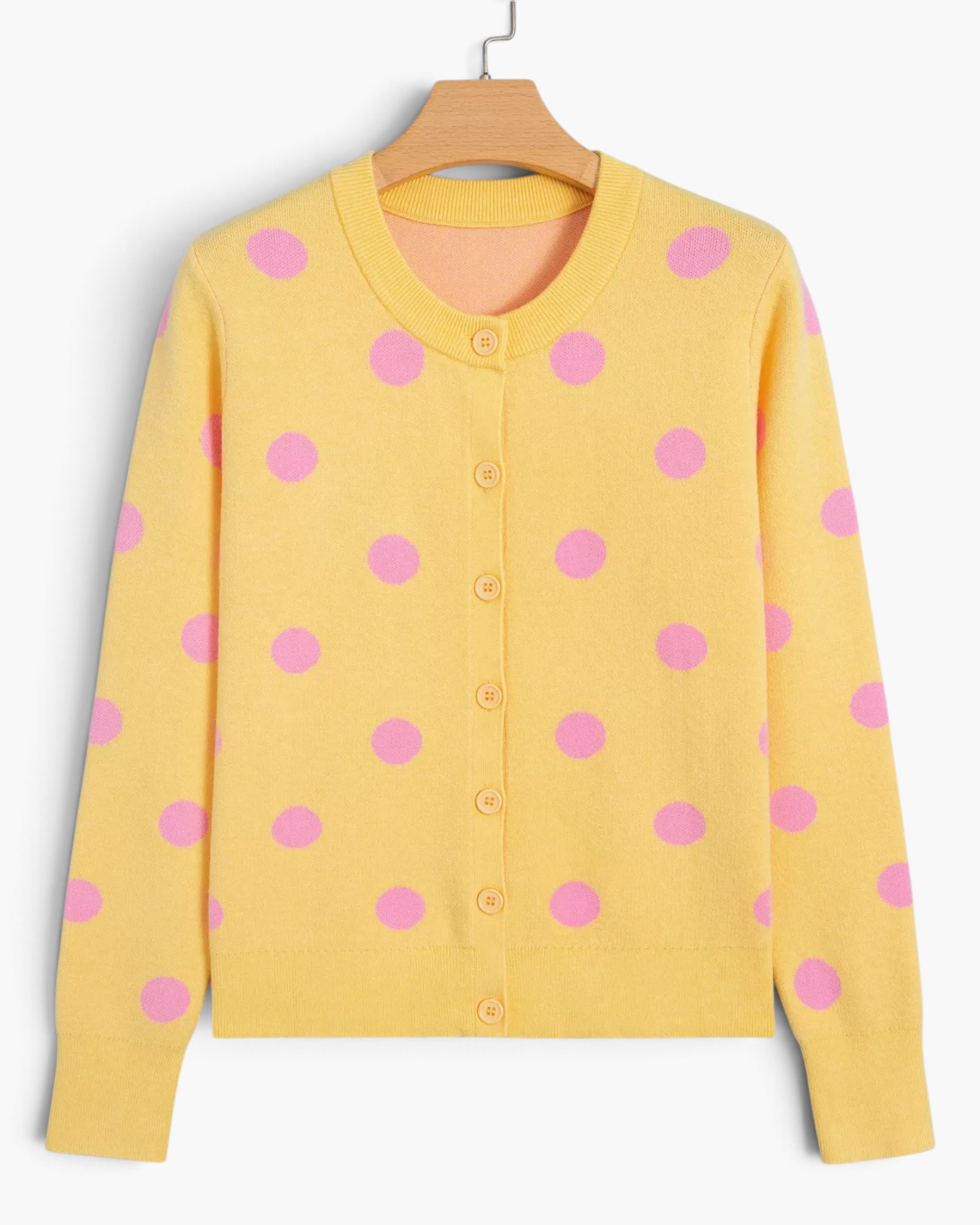 Beach Rose Co. yellow knit cardigan with pink polka dots, round neckline, and button-front closure.