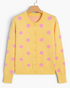 Beach Rose Co. yellow knit cardigan with pink polka dots, round neckline, and button-front closure.