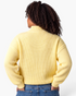 Beach Rose Co. yellow ribbed knit sweater with a stand collar and dropped shoulders, shown from the back.