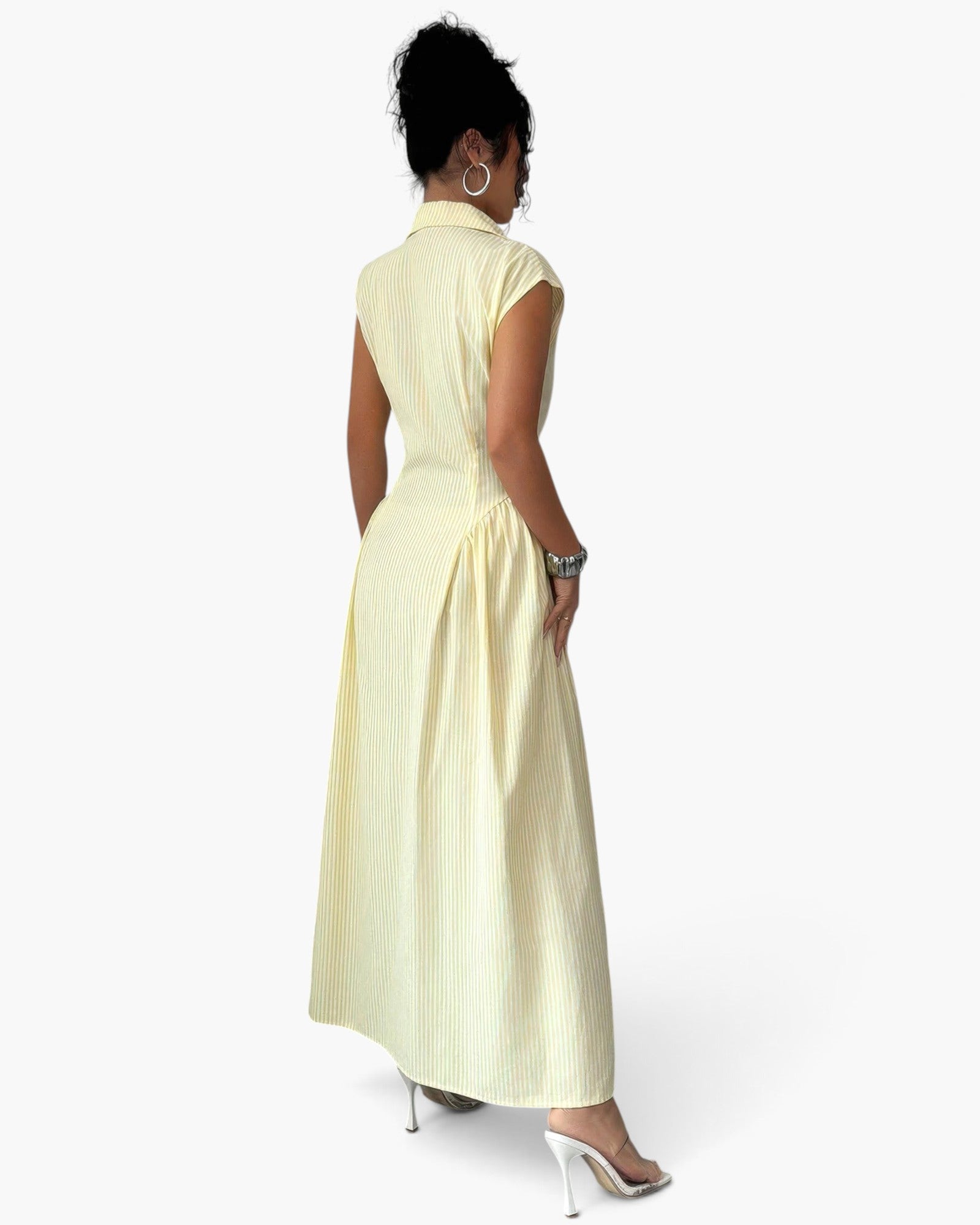 Beach Rose Co. yellow striped long dress with cap sleeves, collared neckline, and ruched waist on a model, back view.