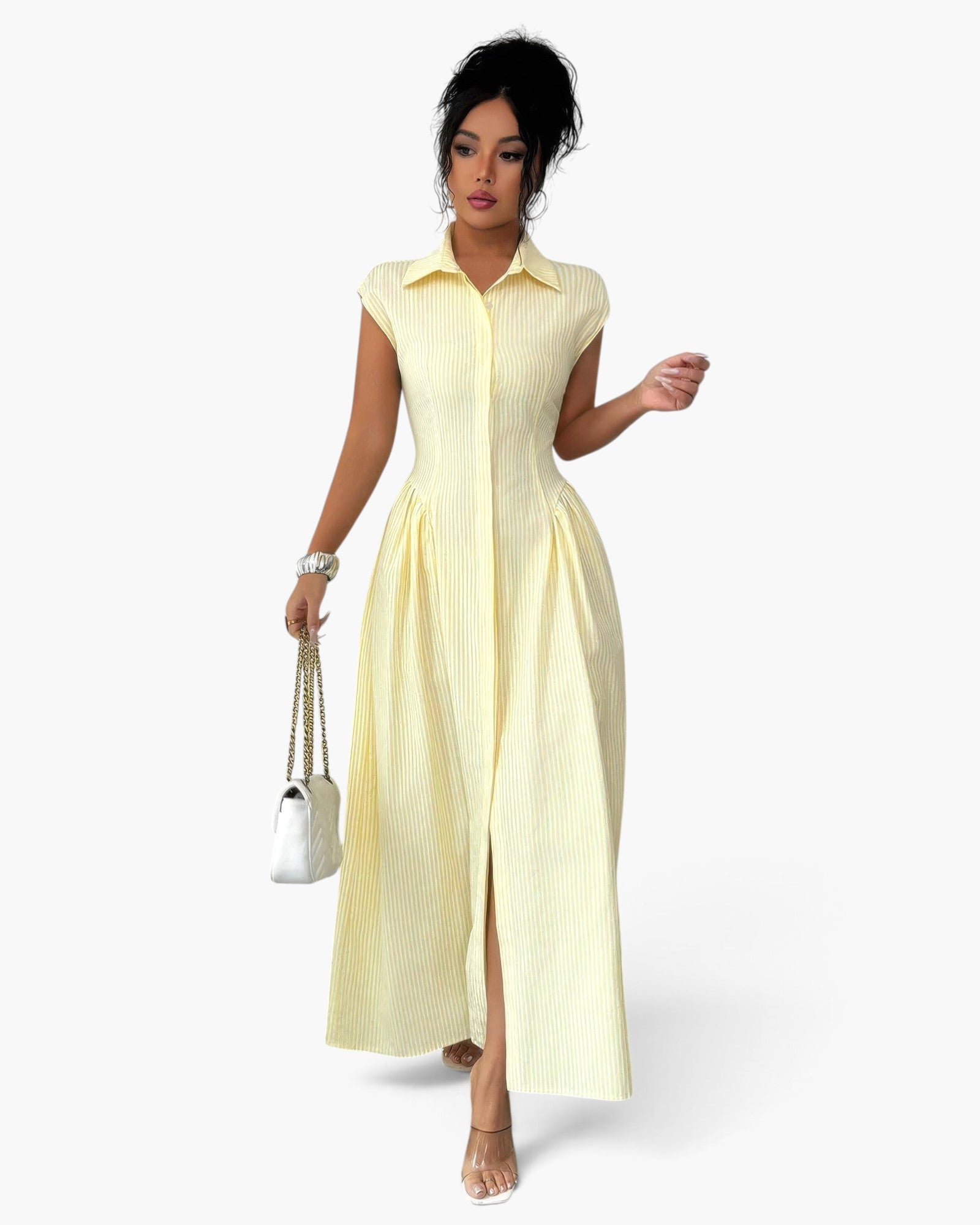 Beach Rose Co. yellow striped long dress with collar, cap sleeves, and ruched waist, worn by a model with a handbag.