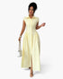 Beach Rose Co. yellow striped long dress with collar, cap sleeves, and ruched waist, worn by a model with a handbag.
