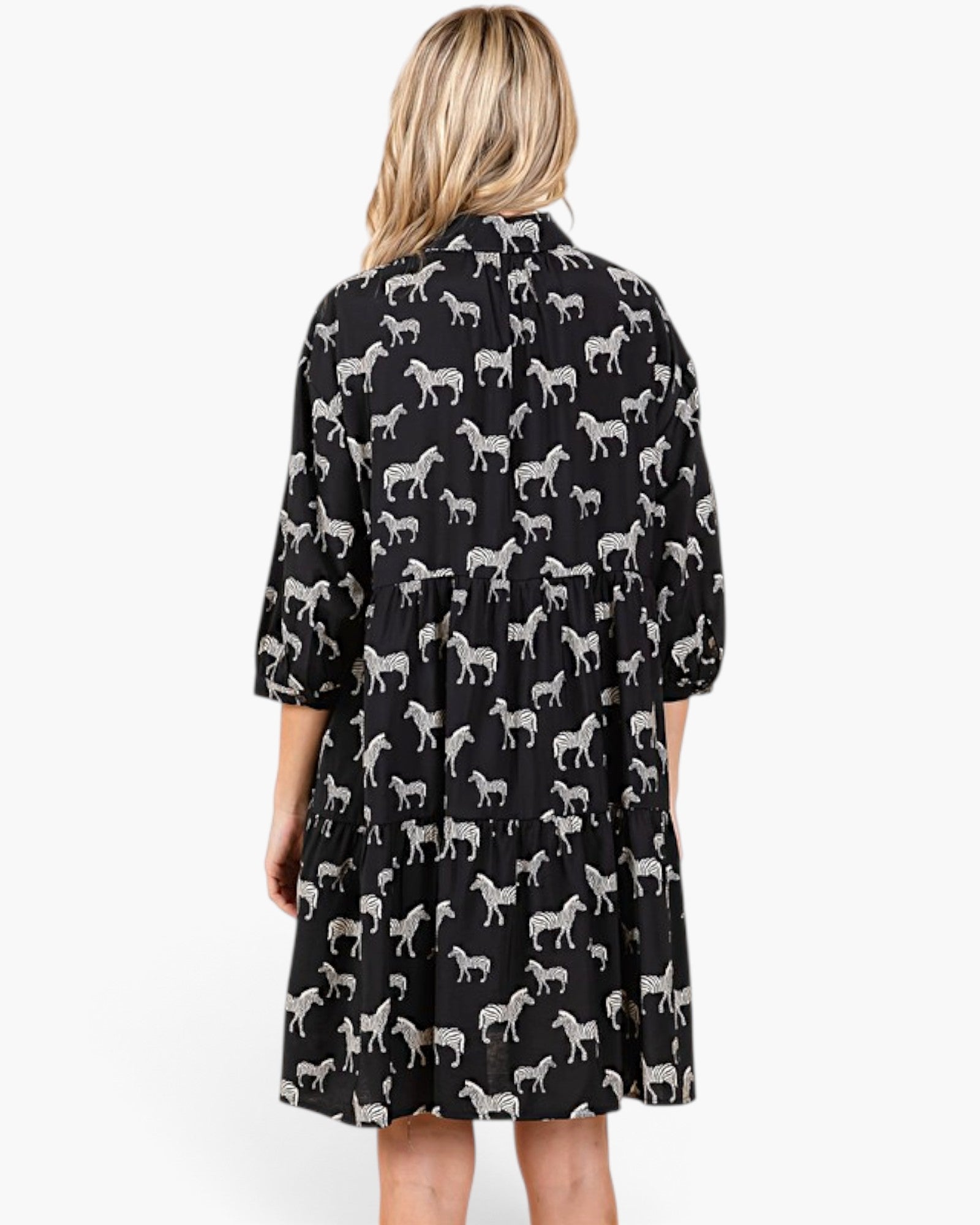 Beach Rose Co. black and white zebra print tiered babydoll dress with three-quarter balloon sleeves, back view