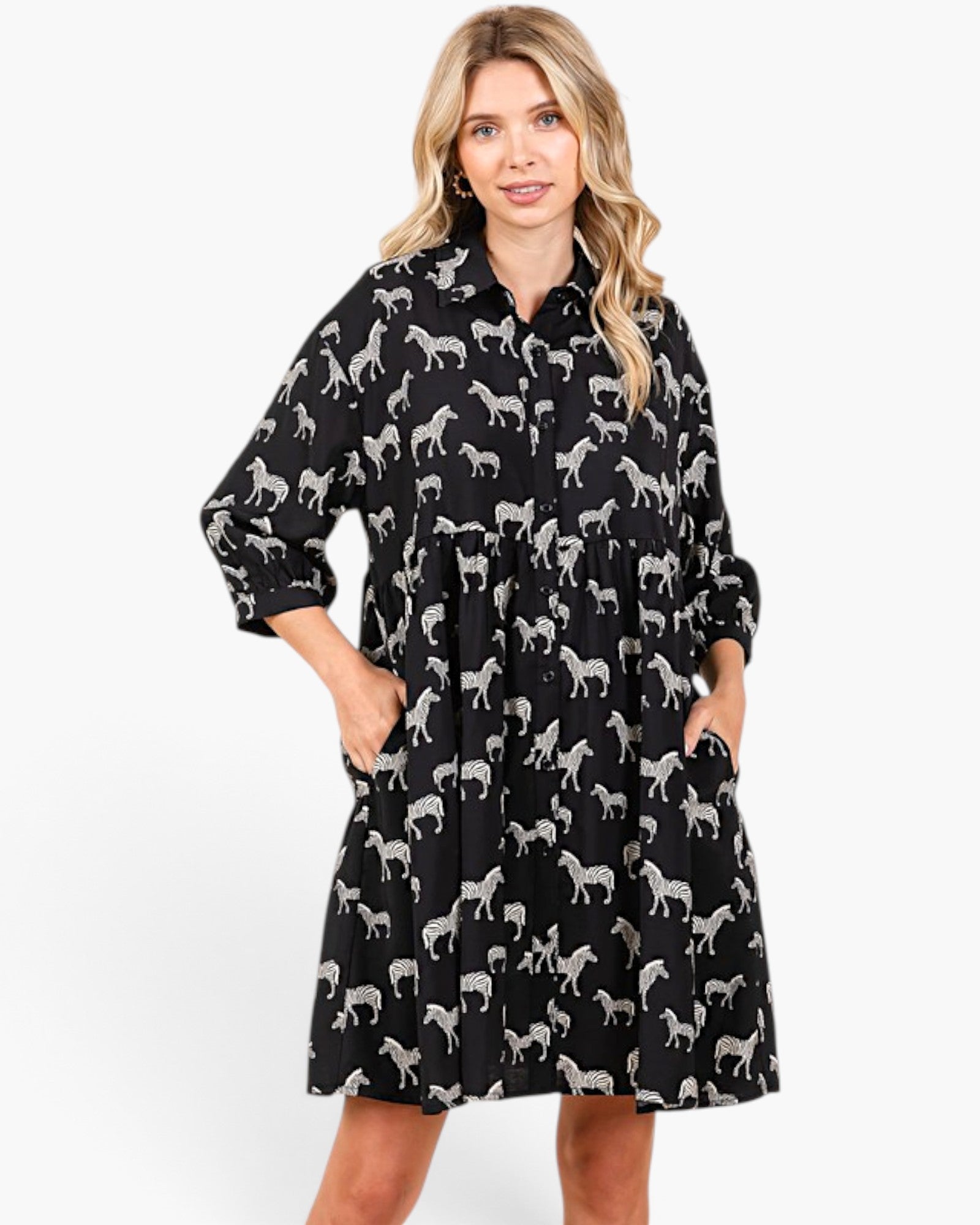 Beach Rose Co. black and white zebra print babydoll dress with a collared button-front and three-quarter sleeves.