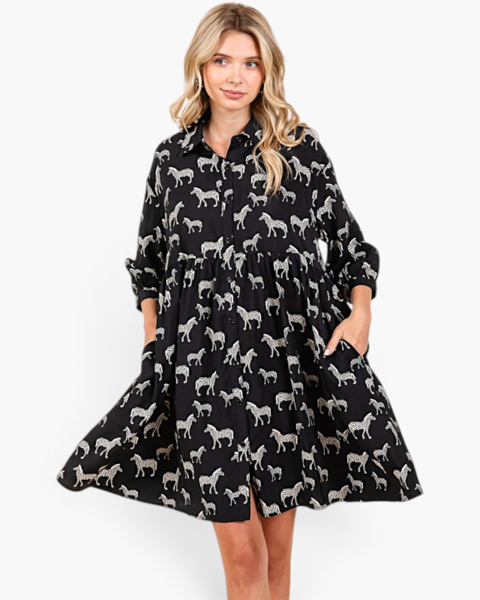 Beach Rose Co. black and white zebra print babydoll dress with a collared button-front and balloon sleeves.
