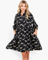 Beach Rose Co. black and white zebra print babydoll dress with a collared button-front and balloon sleeves.