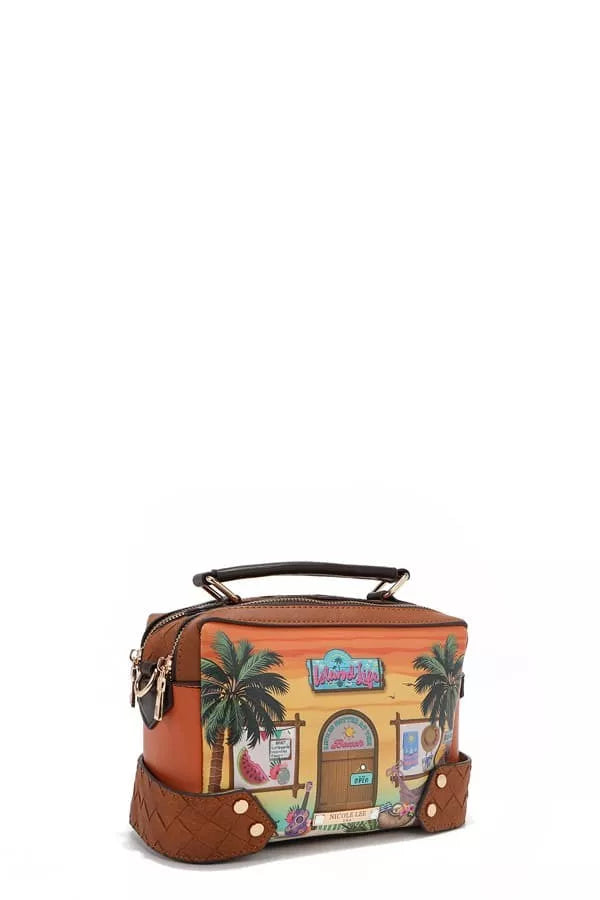 Colorful handbag with a tropical design featuring palm trees and a building on a white background