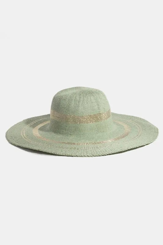 Green sun hat with a decorative band on a white background