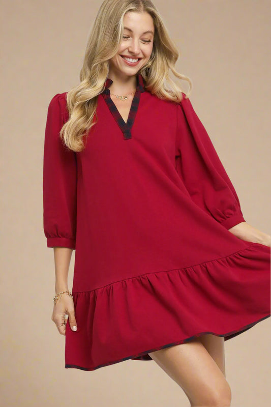 Woman wearing a red dress with a white background