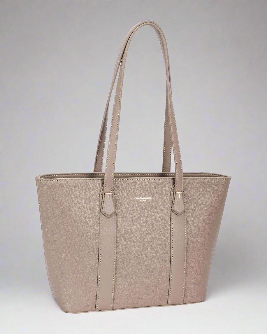 Beige handbag with a visible brand logo on a light gray background