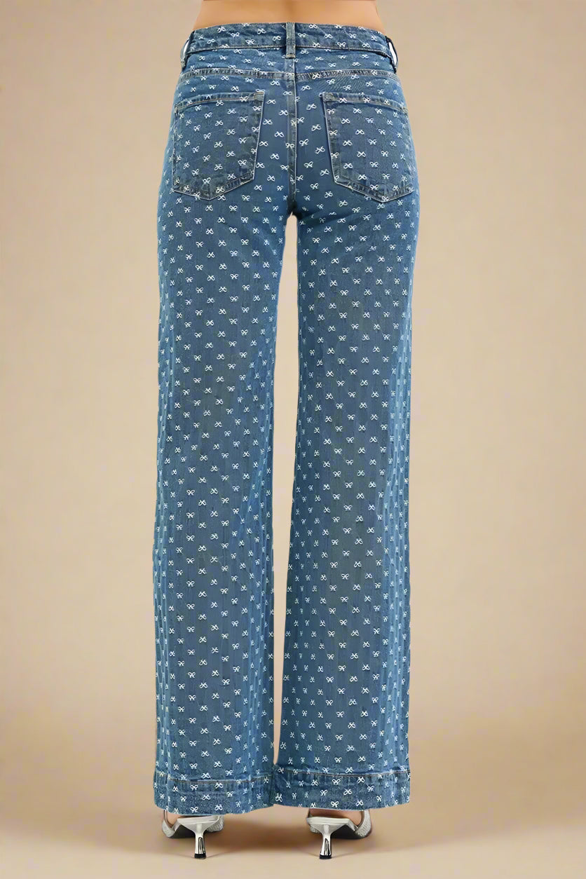 Blue patterned jeans on a beige background
