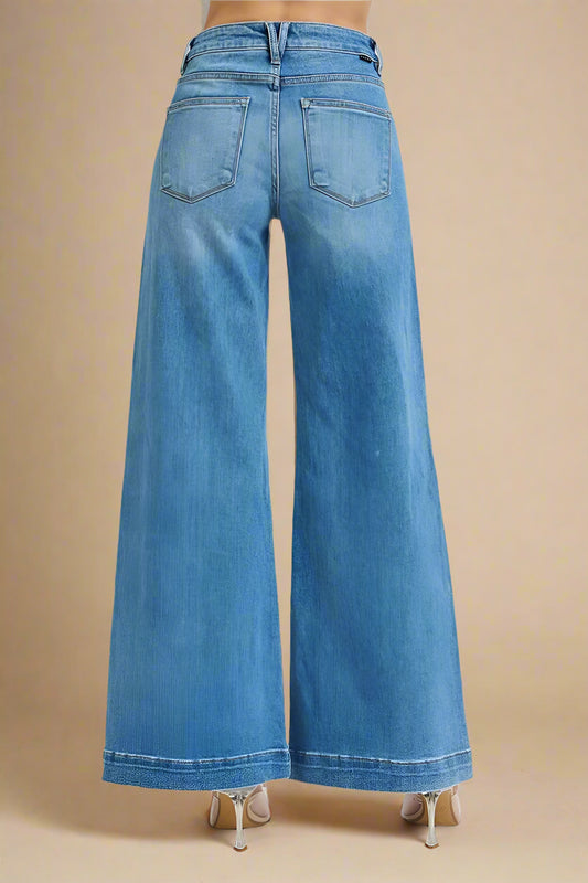 Blue wide-leg jeans on a white background