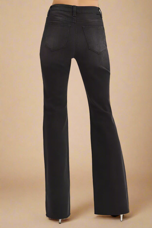 Black flared jeans on a white background