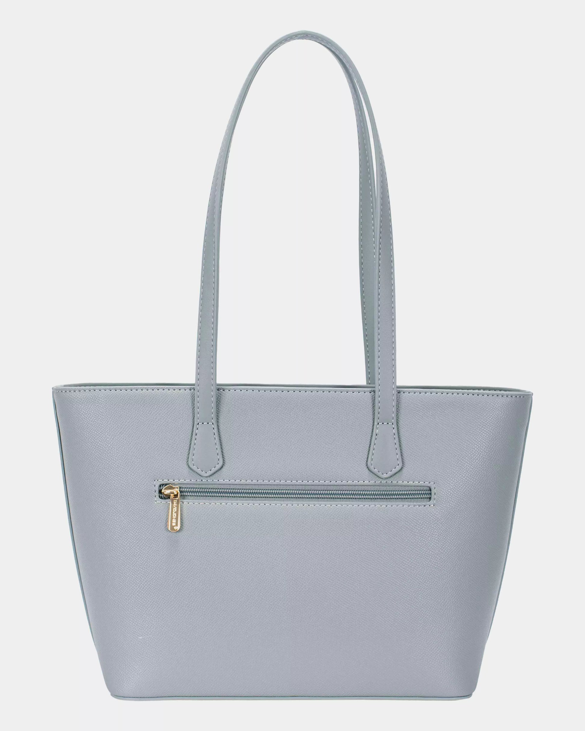 Light blue handbag with a gold zipper on a light gray background