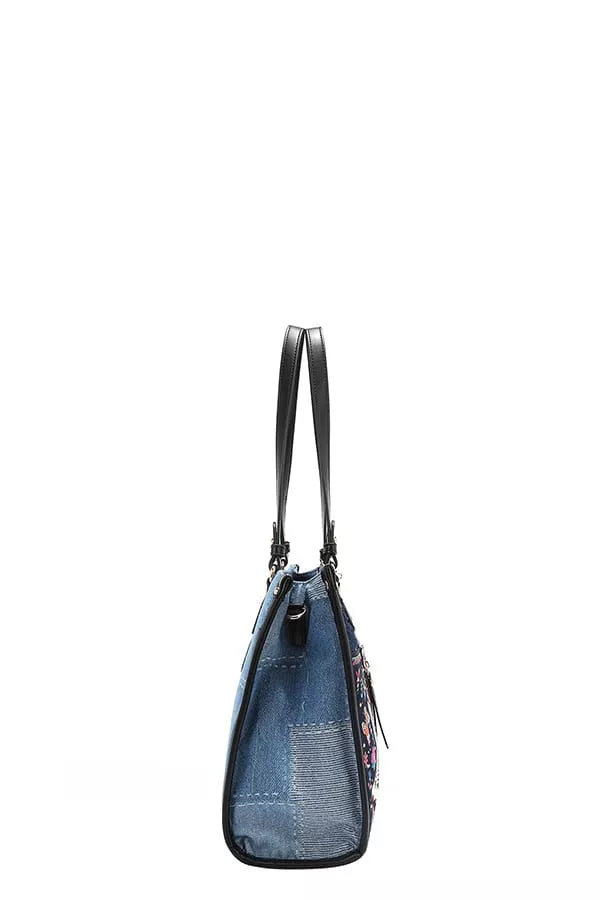 Blue handbag with black straps on a white background