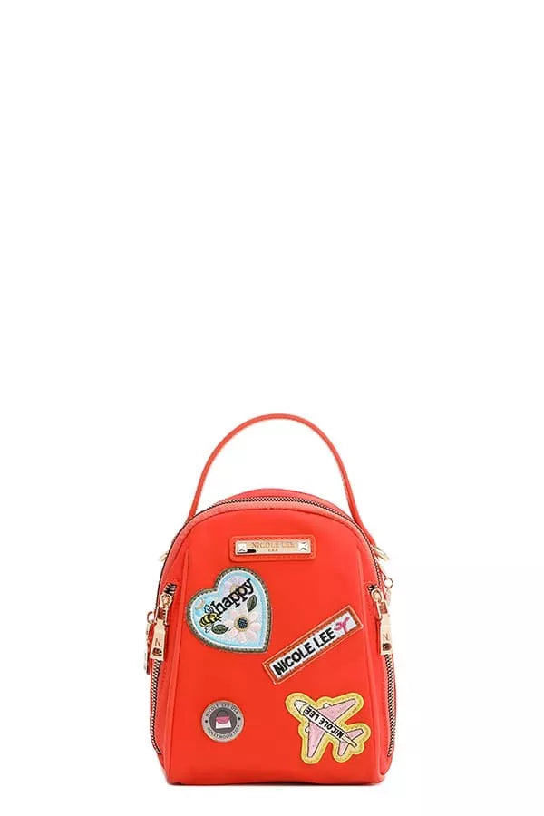 Red backpack with patches on a white background
