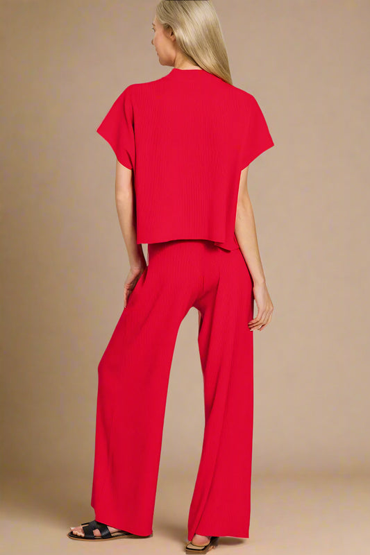 Woman wearing a red outfit on a beige background