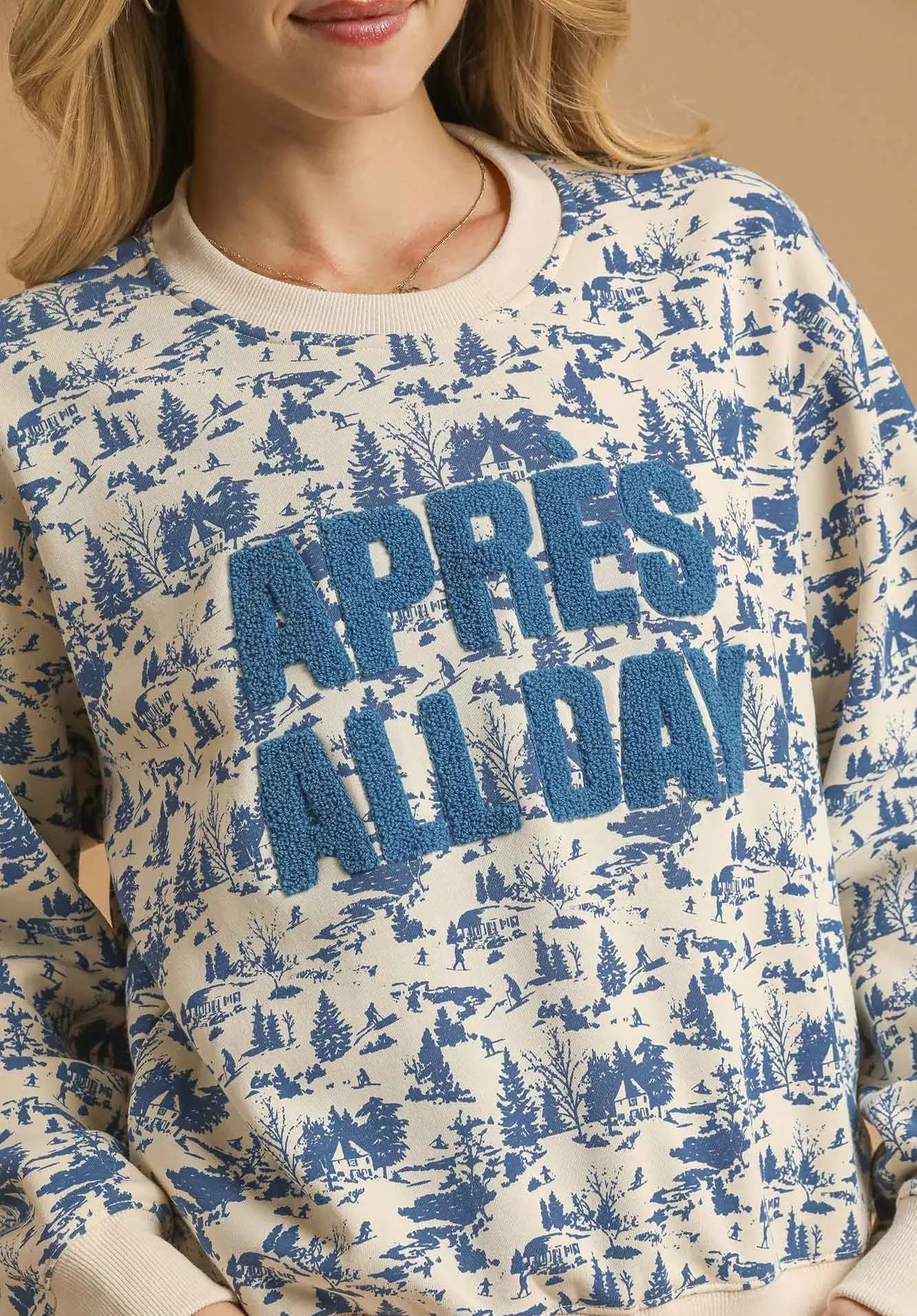 Sweatshirt with blue and white pattern and 'APRES ALL DAY' text