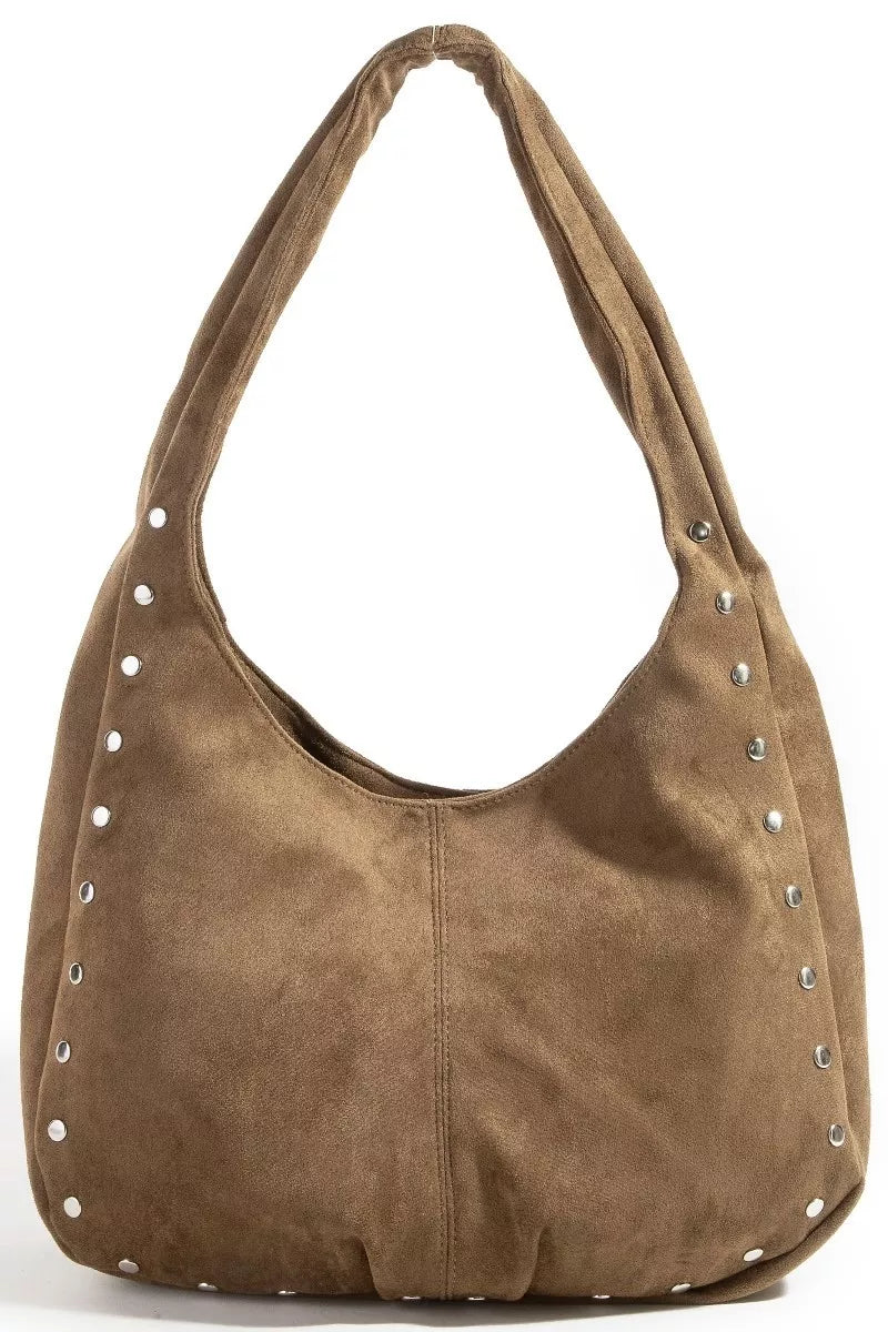 Brown suede handbag with studded details on a white background