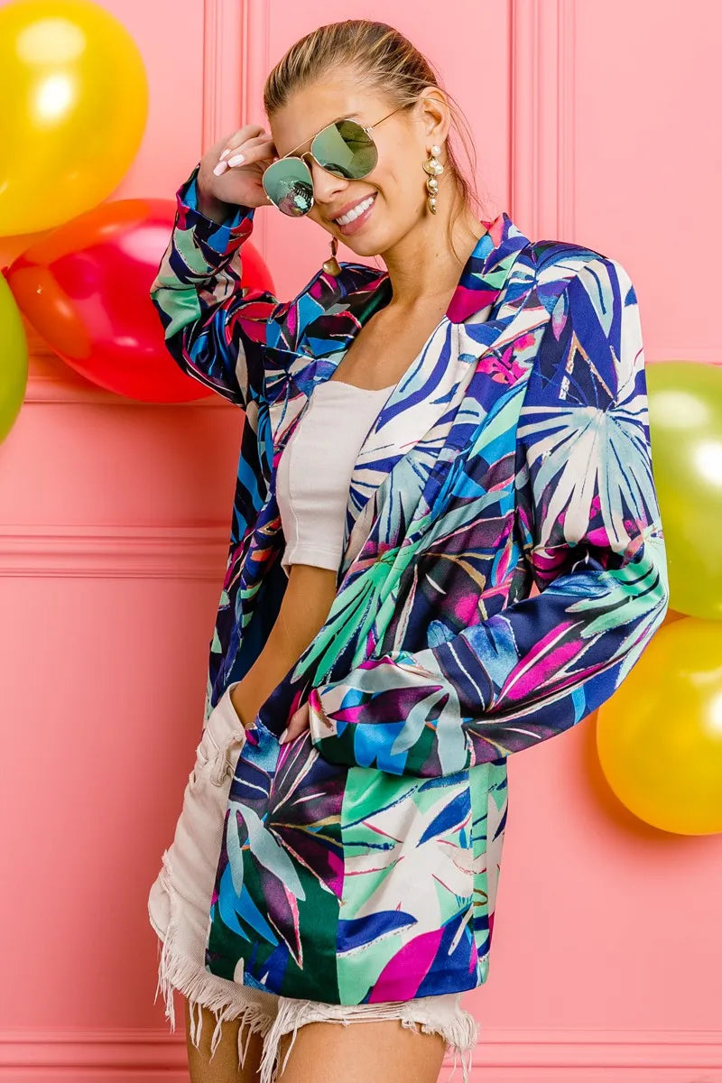 Woman wearing a colorful jacket with balloons in the background