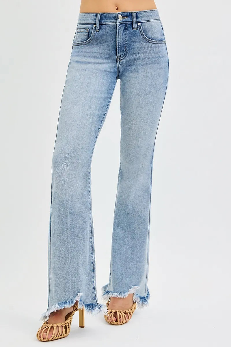 Light blue jeans with frayed hem on a white background