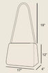 Outline of a handbag with dimensions labeled on a beige background