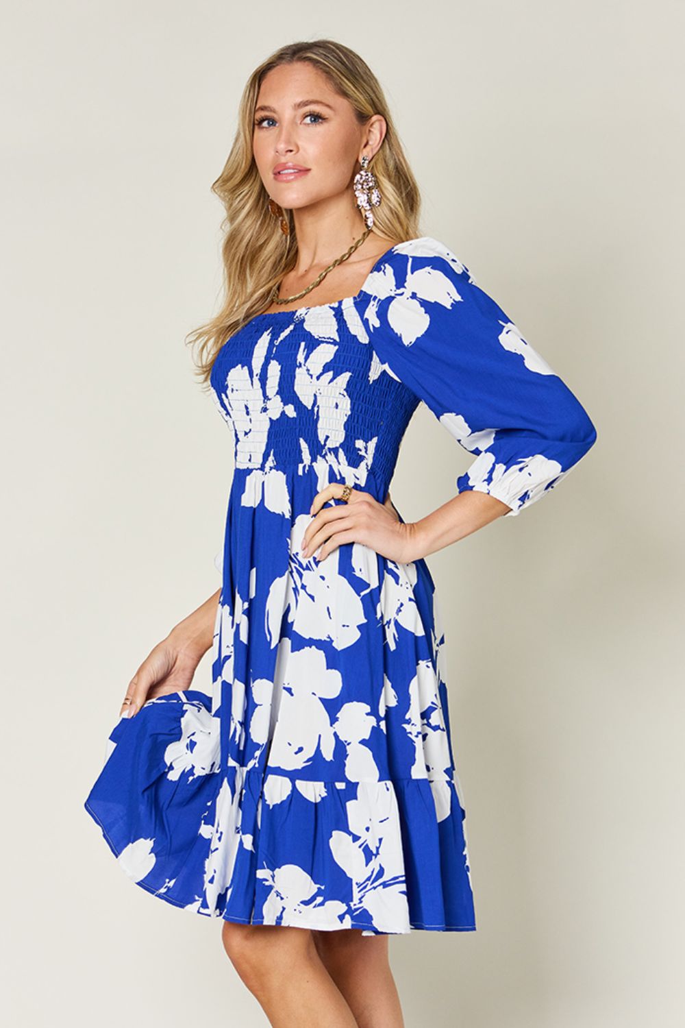 Double Take - Floral Print Ruffle Hem Smocked Knee - Length Dress with Pockets in Royal Blue