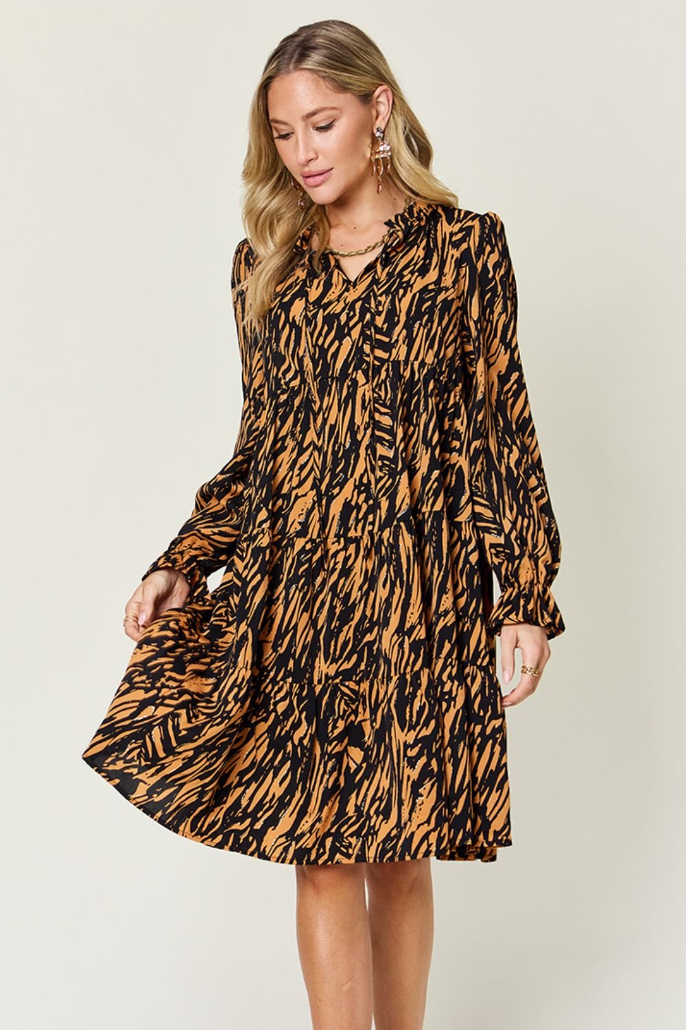 Double Take - Printed Ruffle Hem Long Sleeve Knee - Length Dress in Caramel