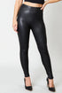 Black leather leggings worn by a person on a white background