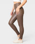 Brown leggings worn by a person on a white background