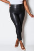 Person wearing black leather leggings on a white background