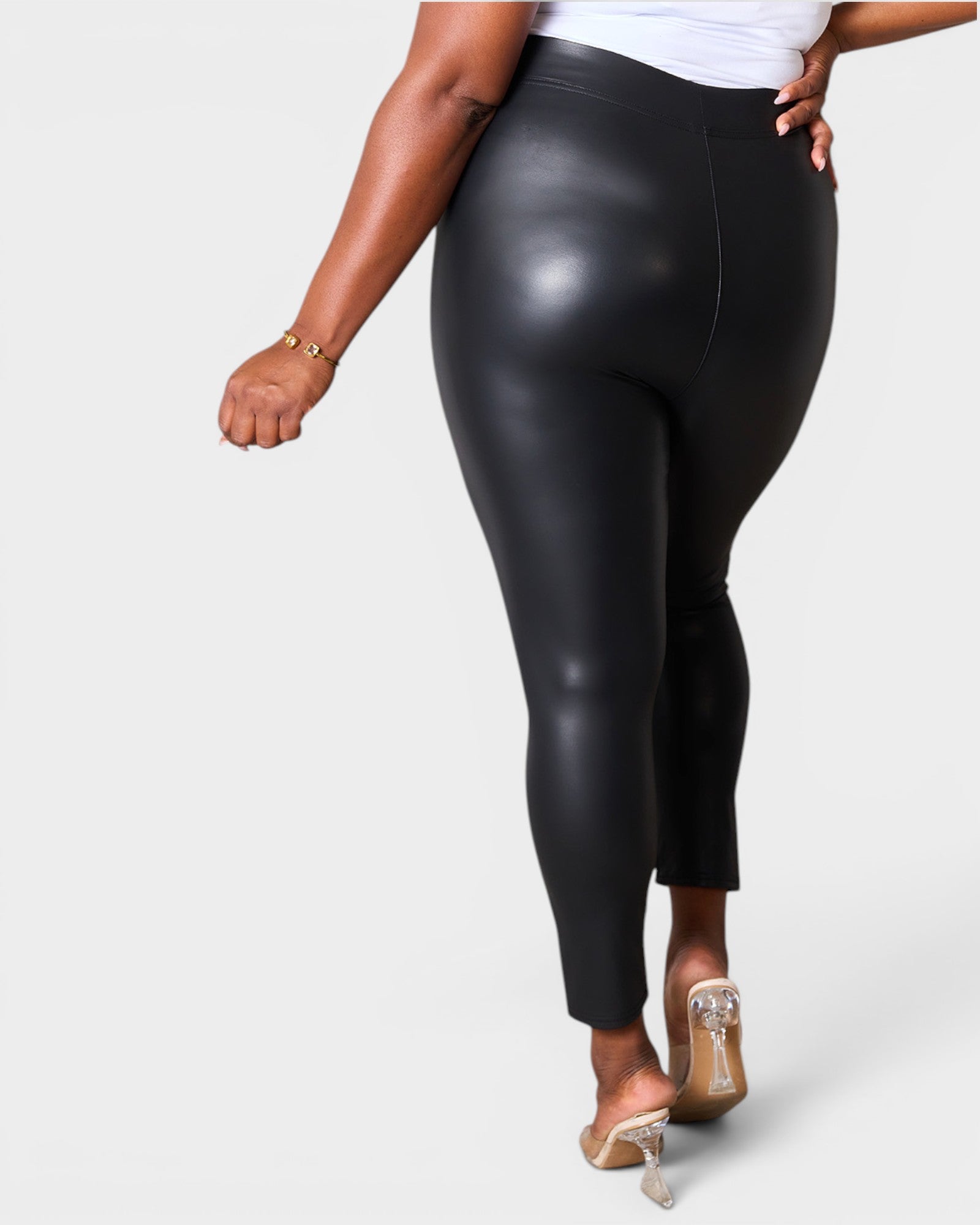 Black leggings worn by a person on a white background