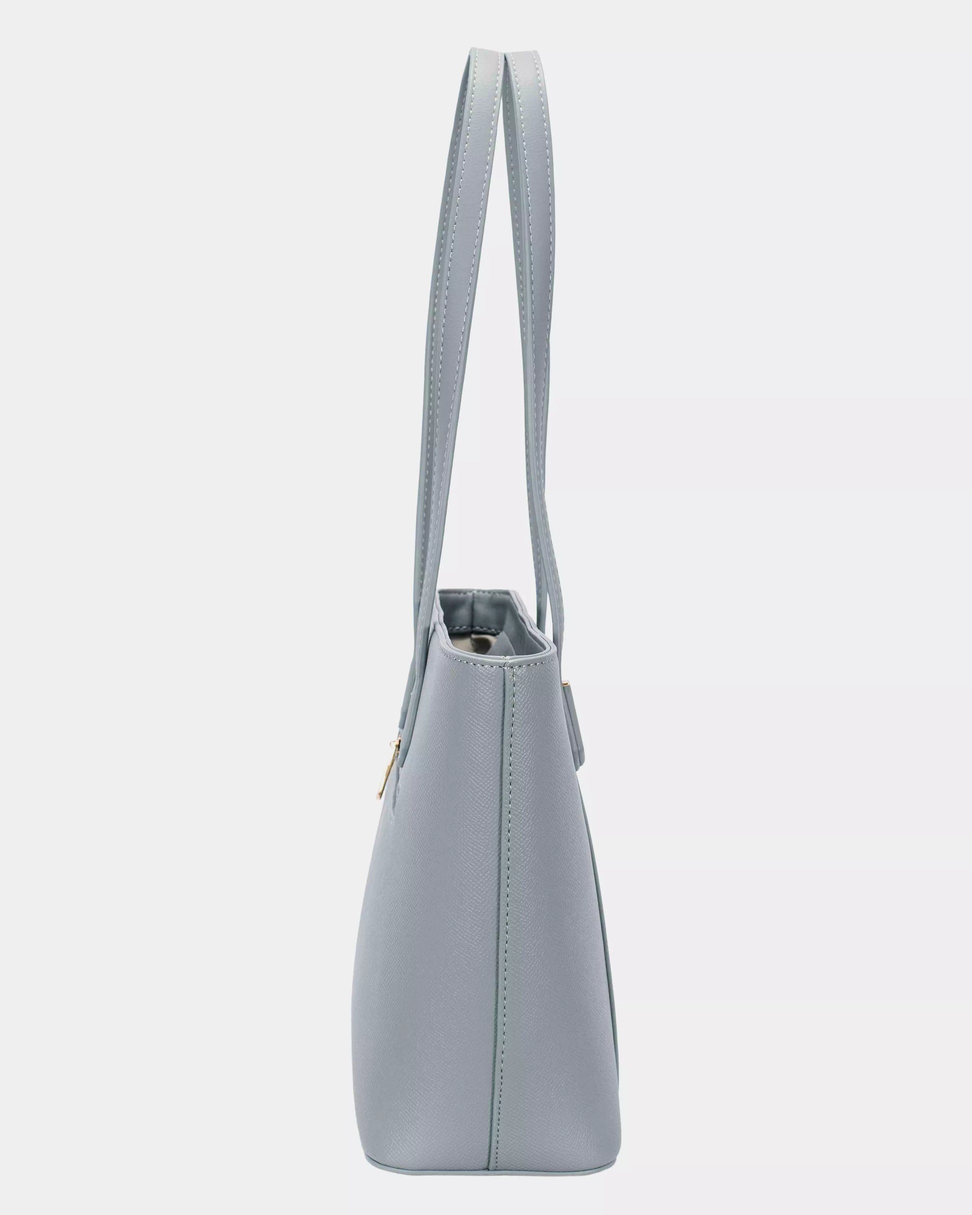 Gray handbag with a strap on a light gray background