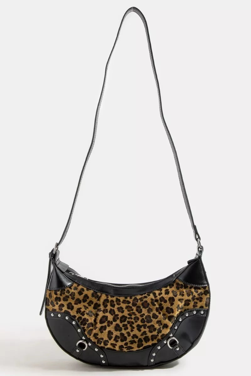 Leopard print handbag with black accents on a white background