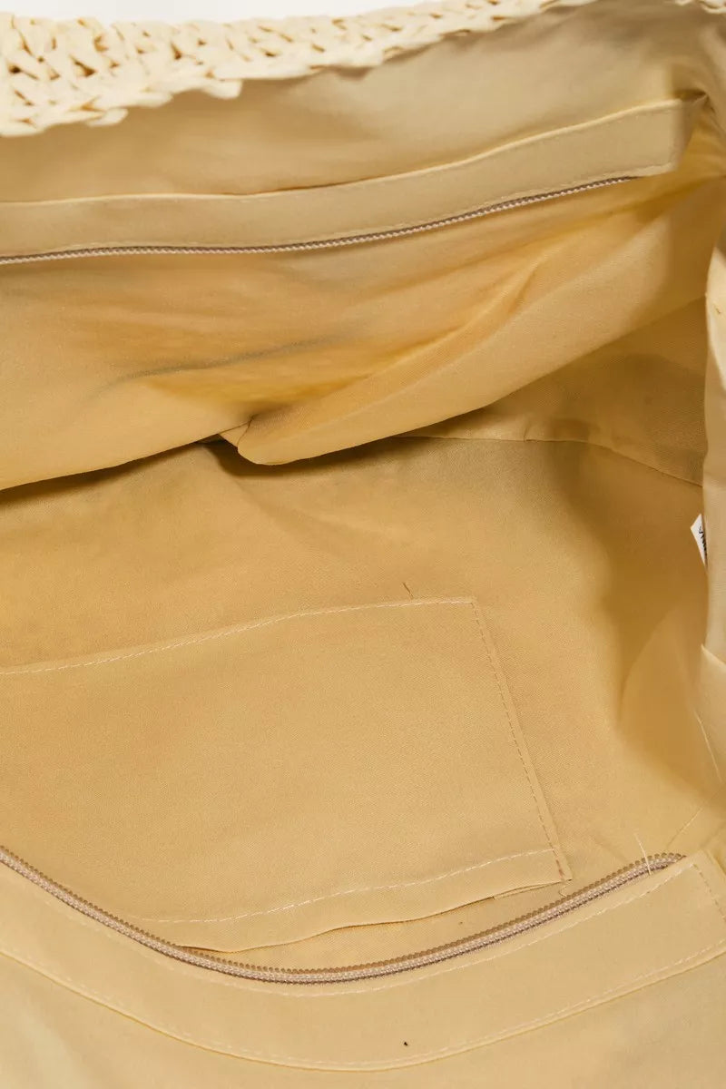 Close-up of a beige fabric with a textured edge