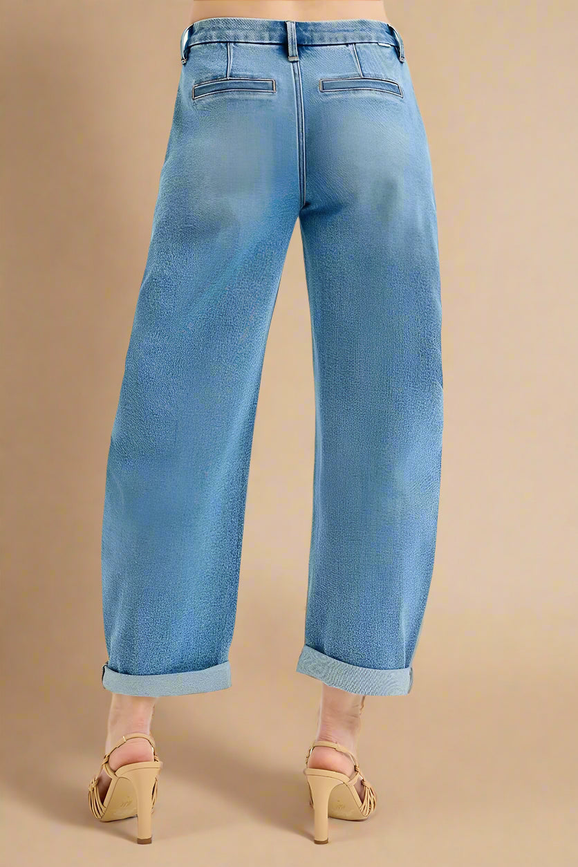 Light blue jeans worn by a person on a white background