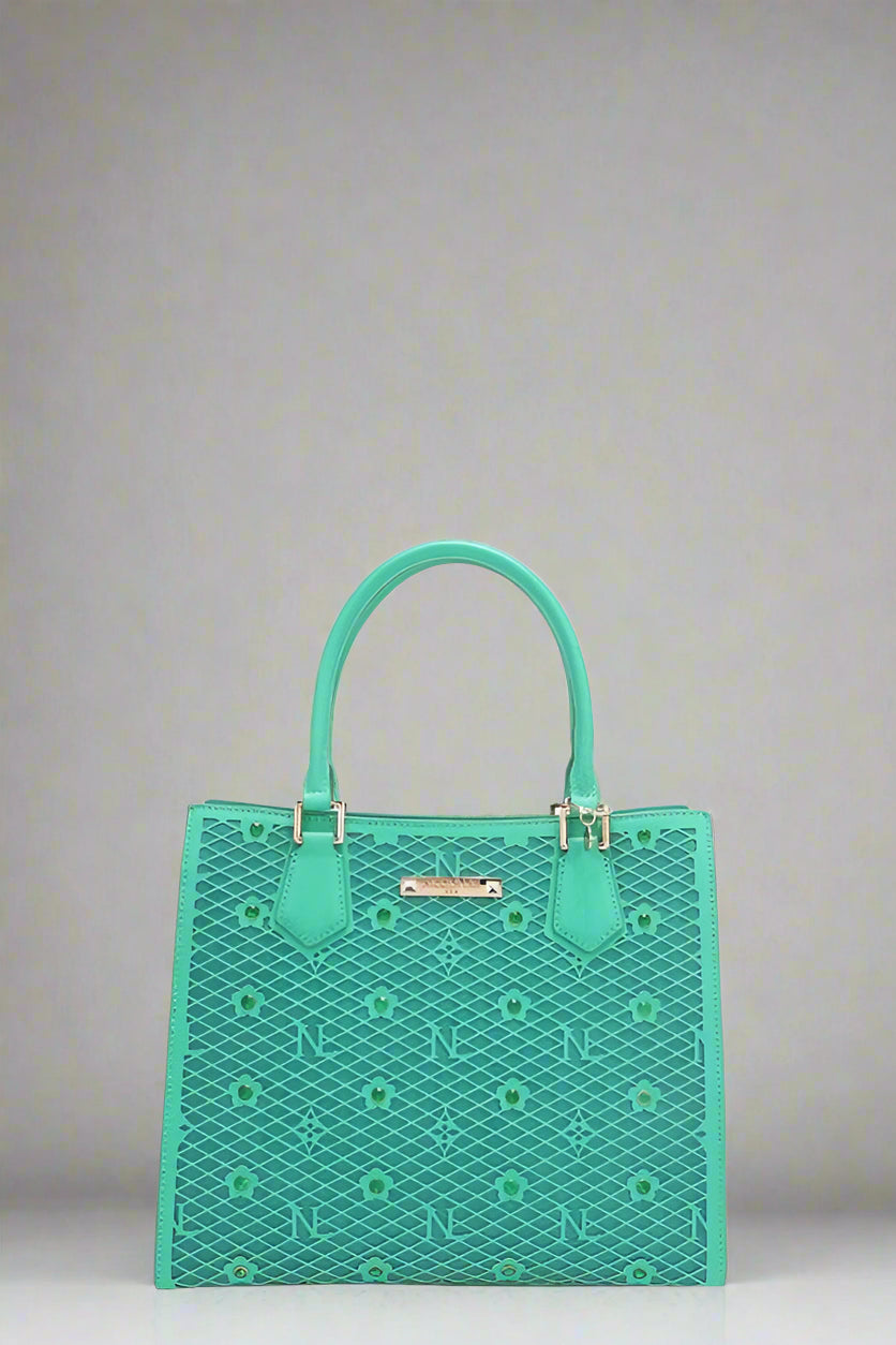 Green handbag with a geometric pattern on a white background