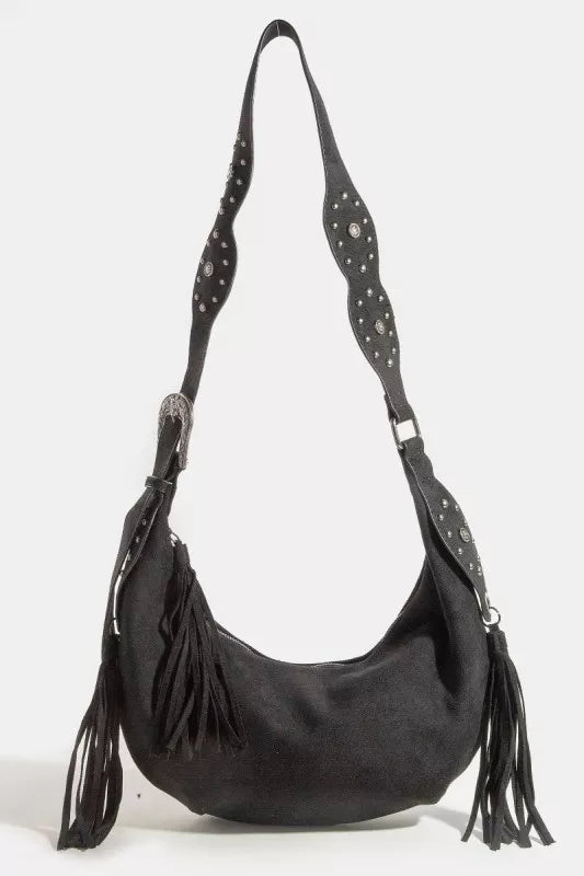 Black handbag with fringes and studded details on a white background