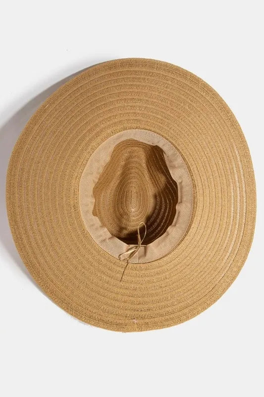 Beige straw hat on a white background