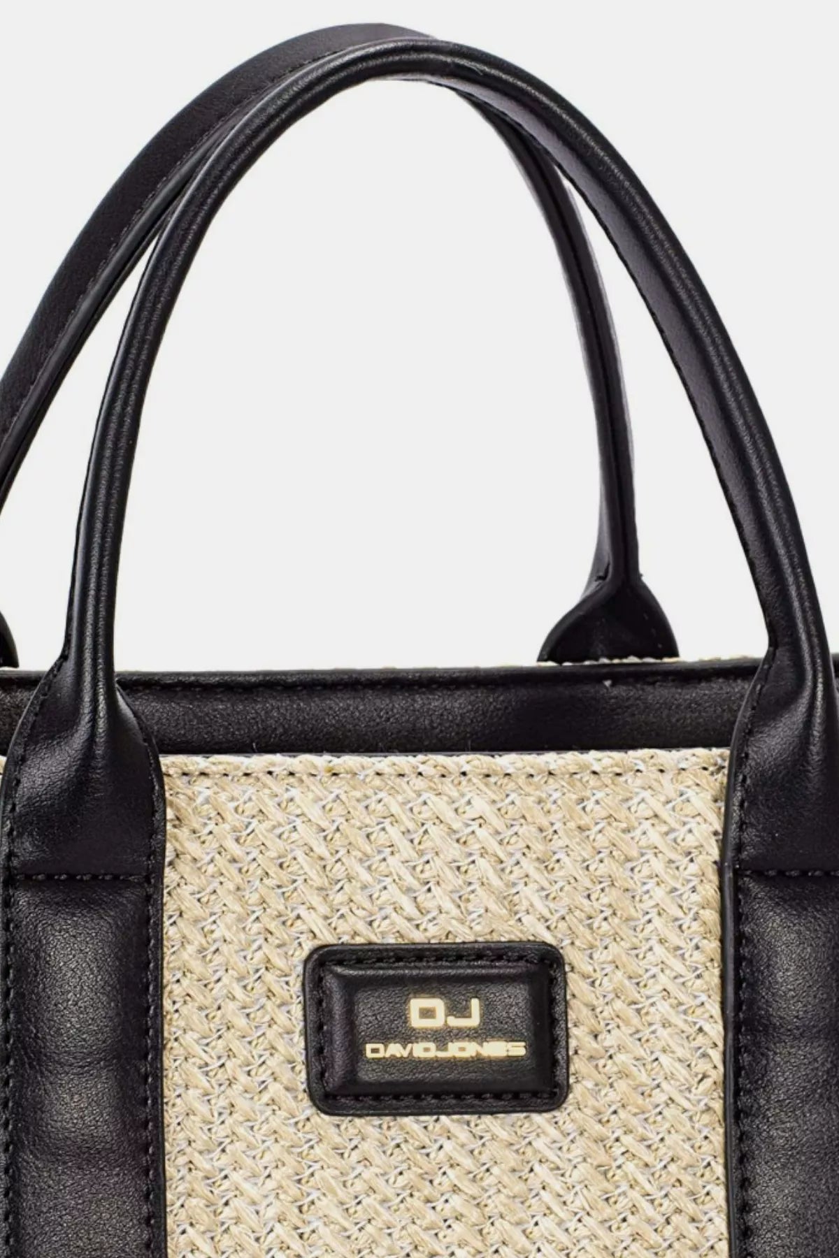 Black handbag with a woven pattern and visible brand logo on a white background