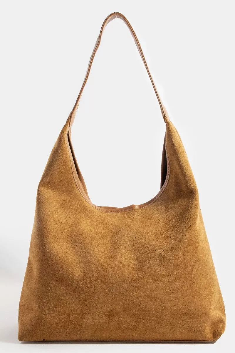Brown leather handbag on a white background