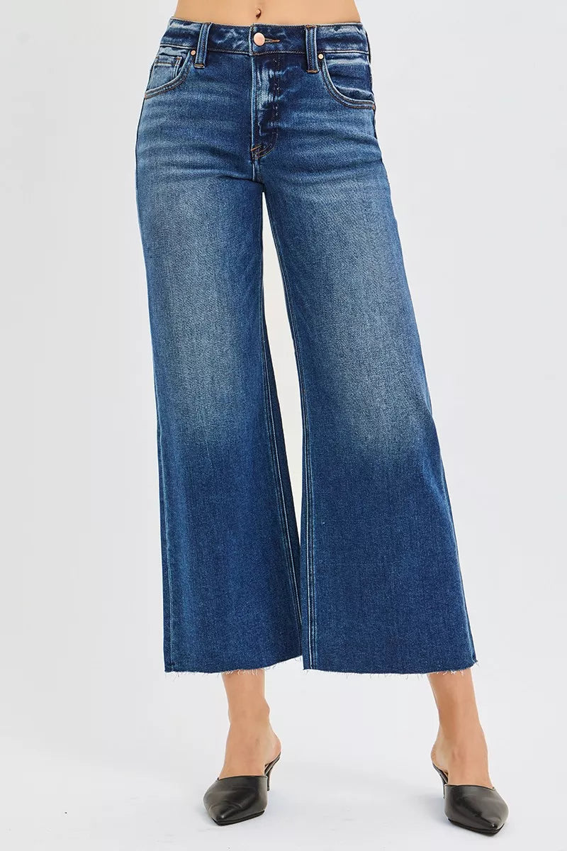 Blue wide-leg jeans on a white background