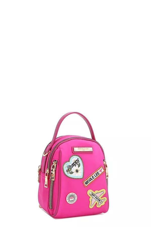 Pink backpack with patches on a white background