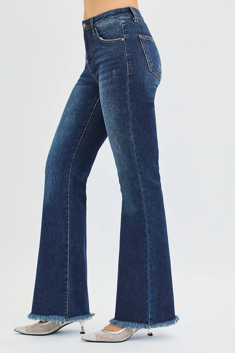 Blue jeans worn by a person on a white background
