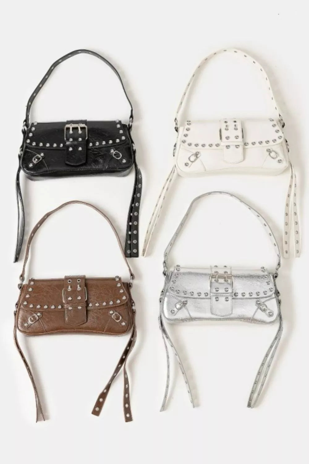 Four handbags in black, white, brown, and silver on a light gray background