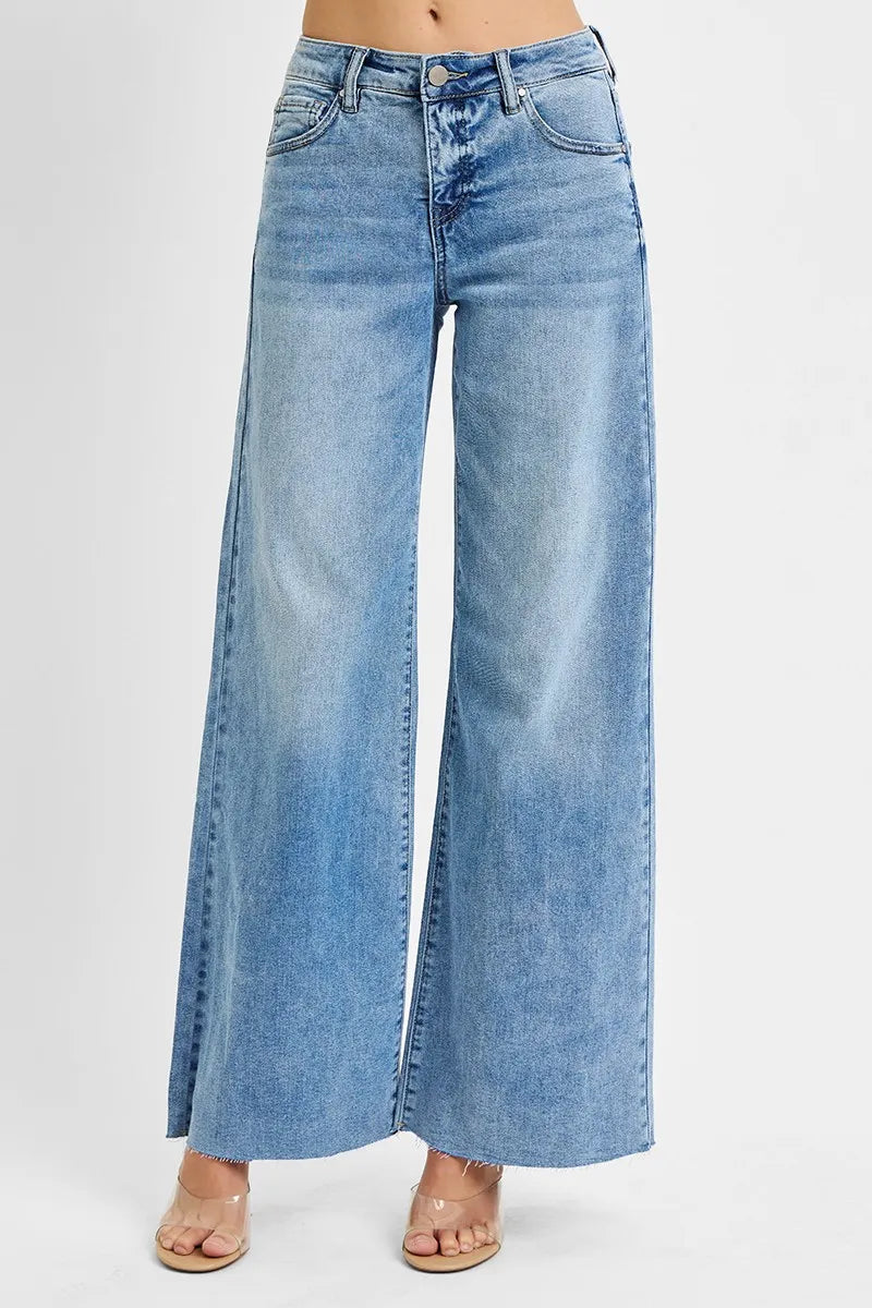 Blue wide-leg jeans on a white background